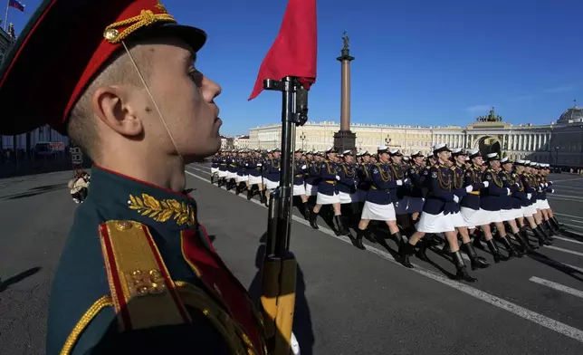 Servicewomen march during a rehearsal for the Victory Day military parade which will take place at Dvortsovaya (Palace) Square on May 9 to celebrate 79 years after the victory in World War II in St. Petersburg, Russia, Tuesday, April 30, 2024. (AP Photo/Dmitri Lovetsky)