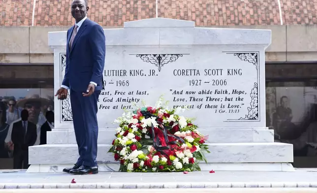 Kenya President William Ruto pauses after laying a wreath at the tombs of Martin Luther King Jr., and Corett Scott King, during a visit to the King Center Monday, May 20, 2024, in Atlanta. (AP Photo/John Bazemore)