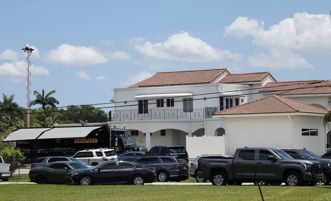 Sean Kingston's Southwest Ranches, Fla., home is shown during a raid by the Broward Sheriff's Office on Thursday, May 23, 2024. A SWAT team raided rapper Kingston's rented mansion on Thursday, and arrested his mother on fraud and theft charges that an attorney says stems partly from the installation of a massive TV at the home. Broward County detectives arrested Janice Turner, 61, at the home. (Amy Beth Bennett/South Florida Sun-Sentinel via AP)