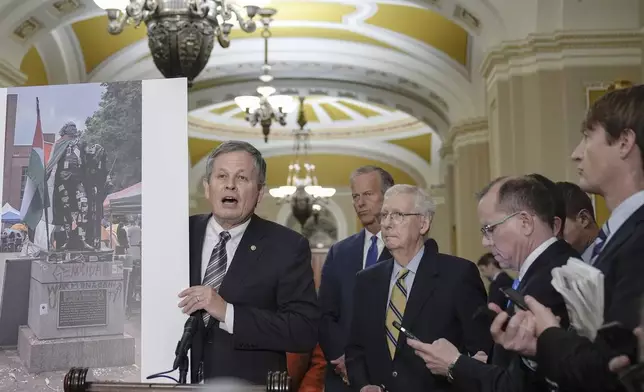 Sen. Steve Daines, R-Mont., left, talks after a policy luncheon on Capitol Hill Wednesday, May 8, 2024, in Washington. (AP Photo/Mariam Zuhaib)