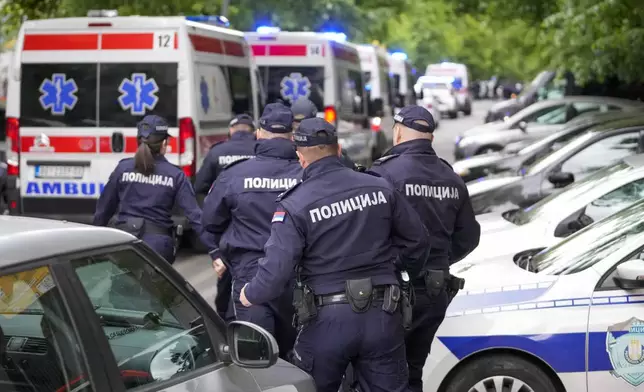 FILE - Police officers block the streets surrounding the Vladislav Ribnikar school in Belgrade, Serbia, Wednesday, May 3, 2023. A teenage boy opened fire at the school on the morning of May 3, 2023. Eight children and a school guard died, and seven people were wounded. One of the wounded, a child, died from injuries later. A total of 10 people were killed. (AP Photo/Darko Vojinovic, File)