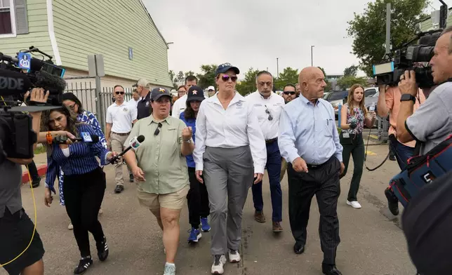FEMA Administrator Deanne Criswell, center, visits an apartment complex damaged by severe storms with Houston Mayor John Whitmire, right, Tuesday, May 21, 2024, at Spring Branch in Houston. (Yi-Chin Lee/Houston Chronicle via AP)