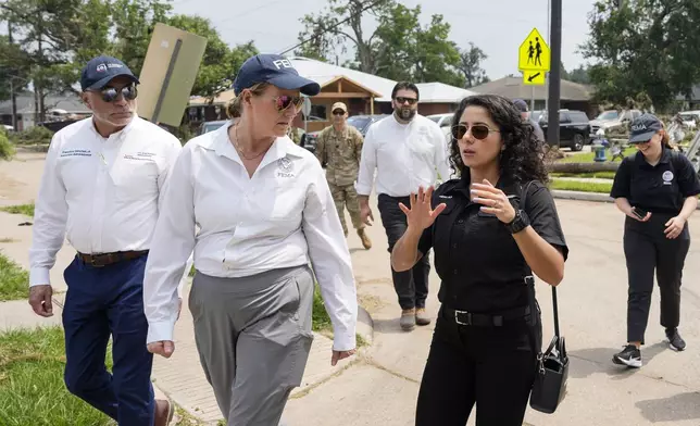 From front left, Francisco Sánchez Jr., associate administrator for the U.S. Small Business Administration's Office of Disaster Recovery &amp; Resilience, FEMA Administrator Deanne Criswell and Harris County Judge Lina Hidalgo visit Sinclair Elementary School after it was damaged by severe storms from the previous week, Tuesday, May 21, 2024, at Timbergrove in Houston. (Yi-Chin Lee/Houston Chronicle via AP)