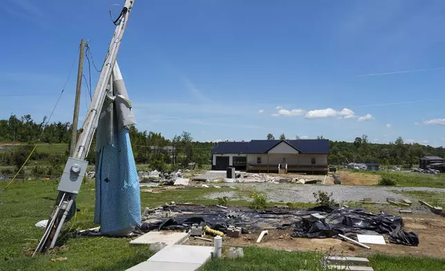 The home site where the Johnson family home is seen along Barnley Loop, Tuesday, May 28, 2024, in Madisonville, Ky. The mobile home as demolished after a series of powerful storms hit the central and southern U.S. over the Memorial Day holiday weekend. (AP Photo/George Walker IV)