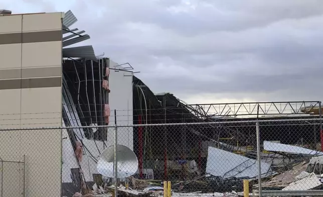 Debris is seen from a damaged FedEx facility after a tornado in Portage, Mich., Tuesday, May 7, 2024. (Brad Devereaux/Kalamazoo Gazette via AP)