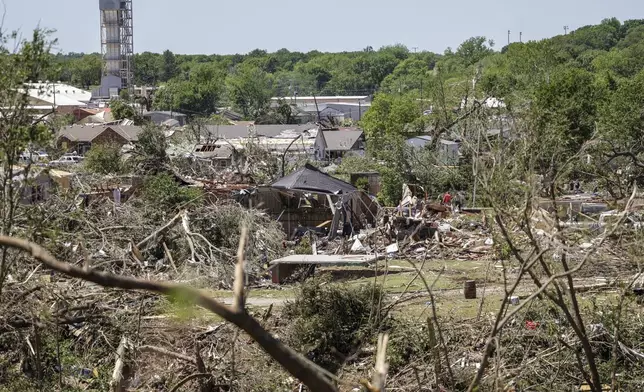 Debris and damage from powerful storms are seen, Tuesday, May 7, 2024 in Barnsdall, Okla. A tornado destroyed homes, forced the evacuation of a nursing home and toppled trees and power lines when it roared through the small Oklahoma town. (Mike Simons/Tulsa World via AP)