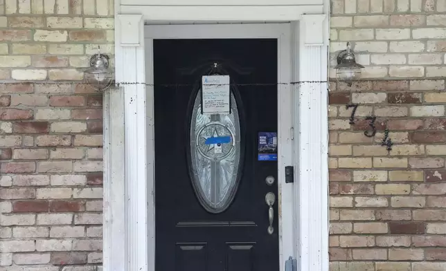 The water line goes almost to the top of the front door of a home in the River Plantation neighborhood on Monday, May 6, 2024, in Conroe, Texas. (Brett Coomer/Houston Chronicle via AP)