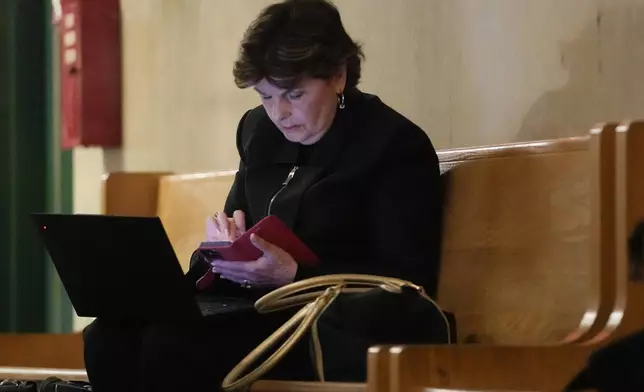 Attorney Gloria Allred works on her laptop outside a Manhattan criminal courtroom, Wednesday, May 1, 2024, in New York. Harvey Weinstein is due back in a New York courtroom for the first time since his 2020 rape conviction was overturned by an appeals court last week. (AP Photo/Mary Altaffer)