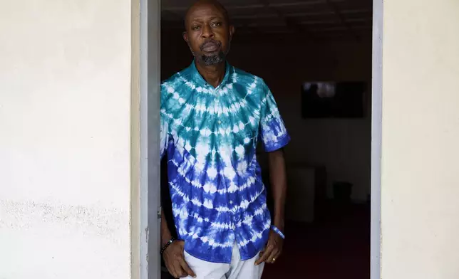 Habib Taigore Kamara, Executive Director of Sierra Leone's Youth Development and Child Link (SLYDCL), stands in his office in Freetown, Sierra Leone, Thursday, April 25, 2024. Habib's organisation provides medical care and psychological support for drug users in Sierra Leone. (AP Photo/ Misper Apawu)