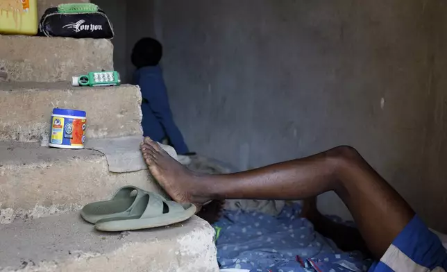 Kush users rest in a room where they receive care in an unconventional rehabilitation centre in the Bombay community, in Freetown, Sierra Leone, Thursday, April 25, 2024. Some youth in the Bombay community are helping Kush addicts stop by rehabilitating them. (AP Photo/ Misper Apawu)