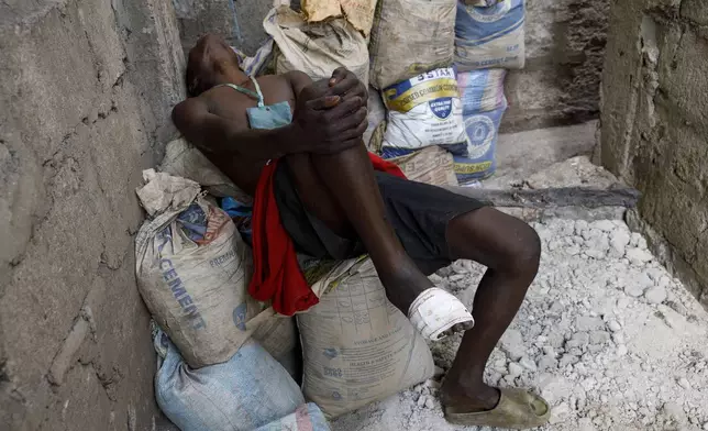 A Kush user reacts after receiving treatment at Sierra Leone's Youth Development and Child Link (SLYDCL), an NGO that provides medical care and psychological needs for drug users in Sierra Leone, Friday, April 26, 2024. Sierra Leone declared a war on the cheap synthetic drug, calling it an epidemic and a national threat. The drug is ravaging youth, and healthcare services are severely limited. (AP Photo/ Misper Apawu)