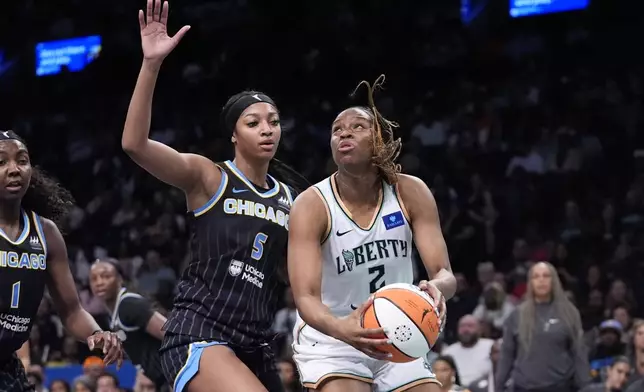 Chicago Sky's Angel Reese (5) defends against New York Liberty's Kennedy Burke (2) during the first half of a WNBA basketball game Thursday, May 23, 2024, in New York. (AP Photo/Frank Franklin II)