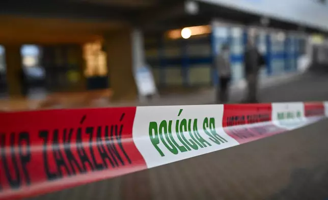 A police line is placed outside the entrance of the F. D. Roosevelt University Hospital, where Slovak Prime Minister Robert Fico, who was shot and injured, is treated in Banska Bystrica, central Slovakia, Wednesday, May 15, 2024. Slovak Prime Minister Robert Fico is in life-threatening condition after being wounded in a shooting after a political event Wednesday afternoon, according to his Facebook profile.(AP Photo/Denes Erdos)