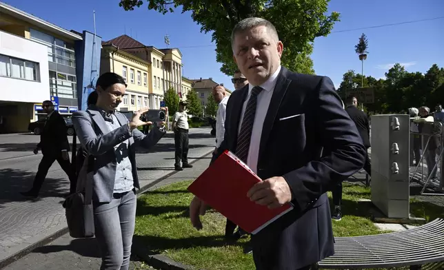 Slovakia's Prime Minister Robert Fico arrives for a cabinet's away-from-home session in the town of Handlova, Slovakia, Wednesday, May, 15, 2024. Prime Minister Robert Fico was shot and injured after the away-from-home government meeting in Handlova, according to information confirmed by Parliamentary Vice-Chair Lubos Blaha, who suspended the House session. (Radovan Stoklasa/TASR via AP)