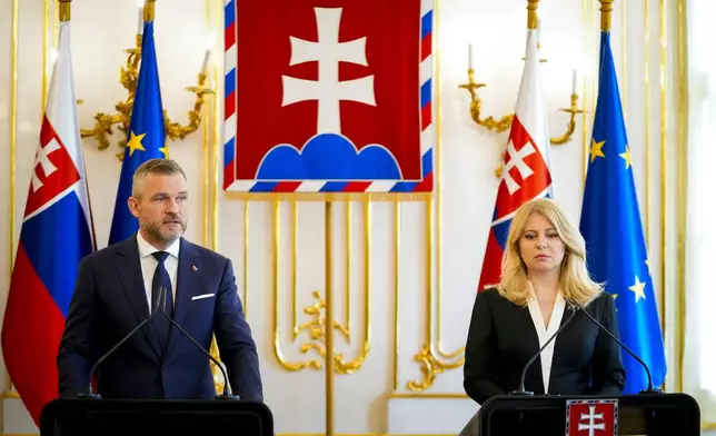 Slovakia's incumbent President Zuzana Caputova, right, and President elect Peter Pellegrini hold a joint press conference at the presidential palace in Bratislava, Slovakia, Thursday, May 16, 2024. Slovak Prime Minister Robert Fico was in serious but stable condition Thursday, a hospital official said, after the populist leader was shot multiple times in an assassination attempt that shook the small country and reverberated across the continent weeks before European elections.(AP Photo/Petr David Josek)