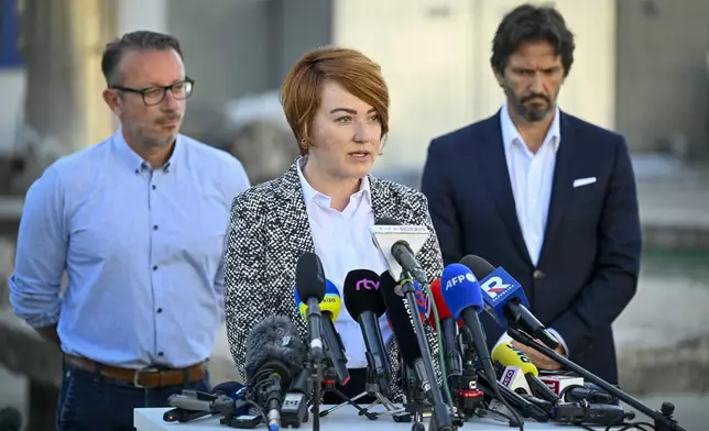 Hospital director Miriam Lapunikova speaks during a media briefing together with Deputy Prime Minister and Defence Minister of Slovakia Robert Kalinak, right, outside the F. D. Roosevelt University Hospital, where Slovak Prime Minister Robert Fico, who was shot and injured, is treated in Banska Bystrica, central Slovakia, Thursday, May 16, 2024. Slovakia's populist Prime Minister Robert Fico was shot multiple times and gravely wounded Wednesday, but his deputy prime minister said he believed Fico would survive. (AP Photo/Denes Erdos)