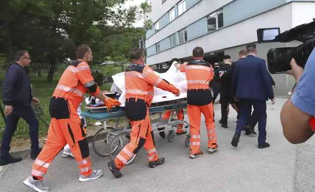 Rescue workers take Slovak Prime Minister Robert Fico, who was shot and injured, to a hospital in the town of Banska Bystrica, central Slovakia, Wednesday, May 15, 2024. Slovakia’s populist Prime Minister Robert Fico is in life-threatening condition after being wounded in a shooting Wednesday afternoon, according to his Facebook profile. (Jan Kroslak/TASR via AP)