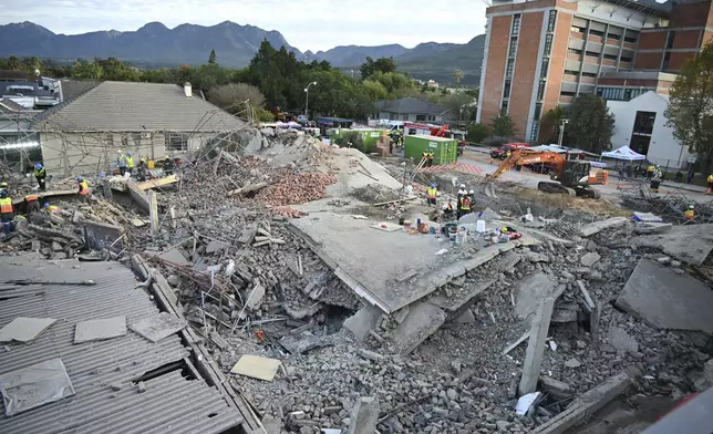 The scene of a collapsed building in George, South Africa, Tuesday, May 7, 2024. Five workers have been killed with 49 still trapped after the building under construction collapsed Monday. (AP Photo)