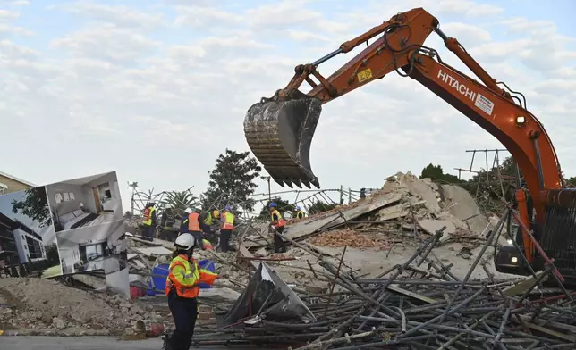 The scene of a colapsed building in George South Africa, Tuesday, May 7, 2024. Five workers have been killed with 49 still trapped after the building under construction collapsed Monday. (AP Photo)