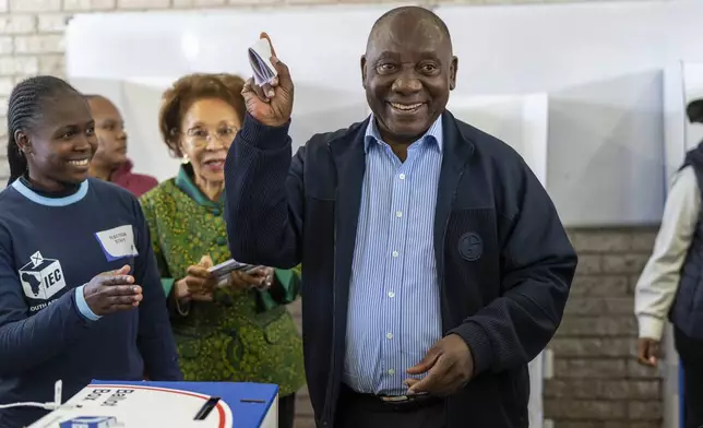 South African President Cyril Ramaphosa casts his ballot Wednesday May 29, 2024 for the general elections in Soweto, South Africa. South Africans are voting in an election seen as their country's most important in 30 years, and one that could put them in unknown territory in the short history of their democracy, the three-decade dominance of the African National Congress party being the target of a new generation of discontent in a country of 62 million people — half of whom are estimated to be living in poverty. (AP Photo/Jerome Delay)