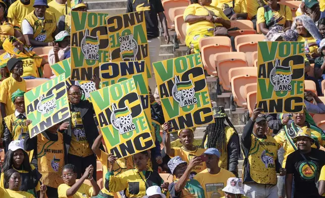 African National Congress supporters wait for South African President Cyril Ramaphosa to arrive at the Siyanqoba rally at FNB stadium in Johannesburg, South Africa, Saturday, May 25, 2024. South African will vote in the 2024 general elections on May 29. (AP Photo/Jerome Delay)