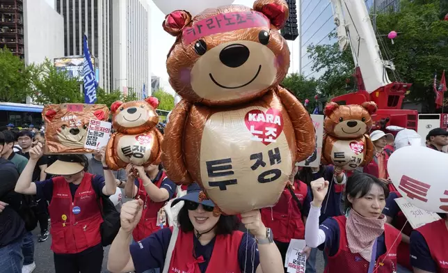 Members of the Korean Confederation of Trade Unions shout slogans during a rally on May Day in Seoul, South Korea, Wednesday, May 1, 2024. Workers, activists and others in Asian capitals took to the streets on Wednesday to mark May Day with protests over rising prices and governments' labor polices and calls for greater labor rights. (AP Photo/Ahn Young-joon)