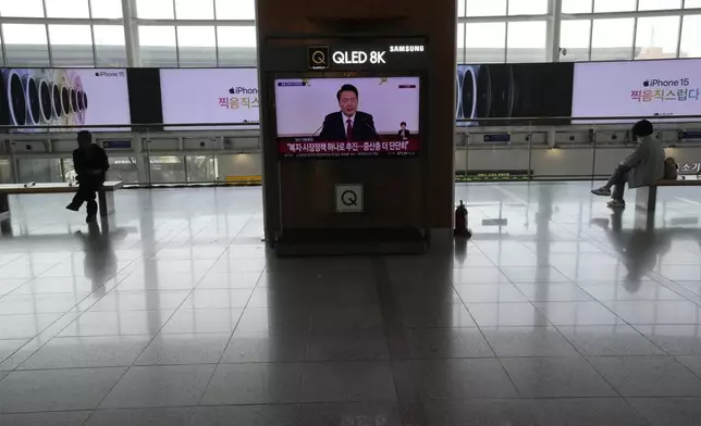 A TV screen shows the live broadcast of South Korean President Yoon Suk Yeol's press conference, at the Seoul Railway Station in Seoul, South Korea, Thursday, May 9, 2024. South Korea’s president on Thursday dismissed calls for independent investigations into allegations involving his wife and top officials, a move expected to draw strong rebukes from his rivals. (AP Photo/Ahn Young-joon)