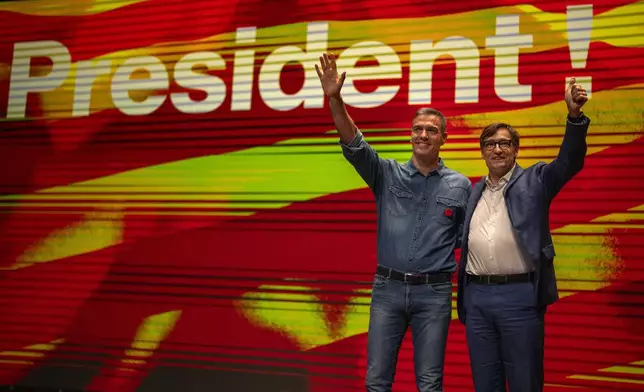 Spanish Prime Minister Pedro Sanchez and socialist candidate, Salvador Illa, right, wave to the crowd during a campaign rally in Villanova i la Gertru, near Barcelona, Spain, Thursday, May 9, 2024. Some nearly 6 million Catalans are called to cast ballots in regional elections on Sunday that will surely have reverberations in Spain's national politics. (AP Photo/Emilio Morenatti)