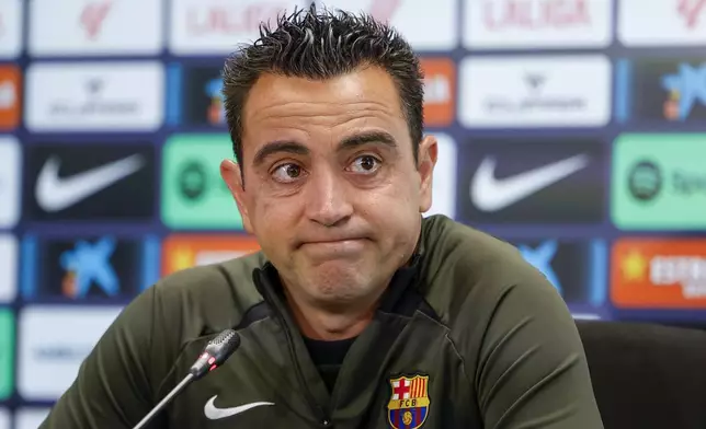 Barcelona's head coach Xavi Hernandez attends a press conference in Barcelona, Spain, Saturday, May 25, 2024. Barcelona says coach Xavi Hernandez is leaving the club at the end of the season. The club made the announcement on Friday after a meeting between club president Joan Laporta, Xavi and other senior figures at the team training ground. (AP Photo/Joan Monfort)
