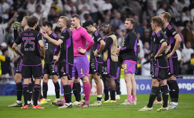 Bayern Munich players react at the end of the Champions League semifinal second leg soccer match between Real Madrid and Bayern Munich at the Santiago Bernabeu stadium in Madrid, Spain, Wednesday, May 8, 2024. (AP Photo/Manu Fernandez)