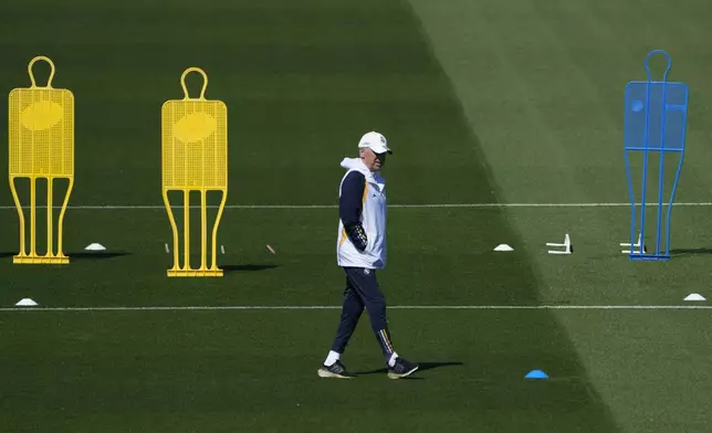 Real Madrid's head coach Carlo Ancelotti walks during a training session in Madrid, Spain, Tuesday, May 7, 2024. The semifinal second leg Champions League soccer match between Real Madrid Bayern Munich will be played on Wednesday in Madrid. (AP Photo/Paul White)
