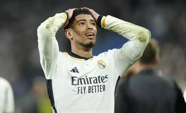 Real Madrid's Jude Bellingham reacts after winning the Champions League semifinal second leg soccer match between Real Madrid and Bayern Munich at the Santiago Bernabeu stadium in Madrid, Spain, Wednesday, May 8, 2024. Real Madrid won 2-1. (AP Photo/Jose Breton)