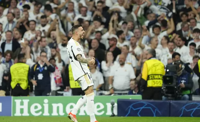 Real Madrid's Joselu celebrates after scoring his side's opening goal during the Champions League semifinal second leg soccer match between Real Madrid and Bayern Munich at the Santiago Bernabeu stadium in Madrid, Spain, Wednesday, May 8, 2024. (AP Photo/Jose Breton)