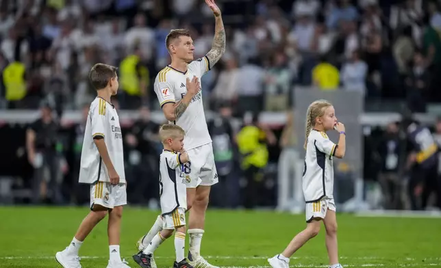 Real Madrid's Toni Kroos waves at the end of the Spanish La Liga soccer match between Real Madrid and Betis at the Santiago Bernabeu stadium in Madrid, Spain, Saturday, May 25, 2024. Real Madrid said the 34-year-old German international "has decided to bring an end to his time as a professional footballer following Euro 2024".(AP Photo/Manu Fernandez)
