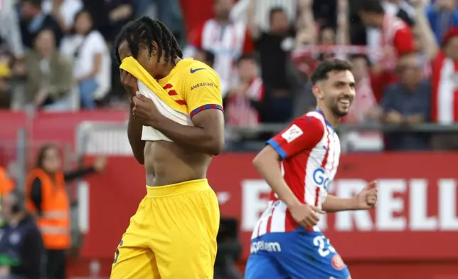 Barcelona's Jules Kounde reacts during the Spanish La Liga soccer match between Girona and Barcelona, at the Montilivi stadium in Girona, Spain, Saturday, May 4, 2024. (AP Photo/Joan Monfort)