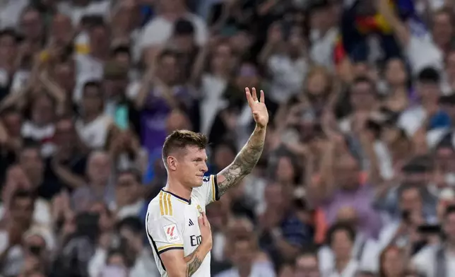 Real Madrid's Toni Kroos waves during the Spanish La Liga soccer match between Real Madrid and Betis at the Santiago Bernabeu stadium in Madrid, Spain, Saturday, May 25, 2024. Real Madrid said the 34-year-old German international "has decided to bring an end to his time as a professional footballer following Euro 2024".(AP Photo/Manu Fernandez)