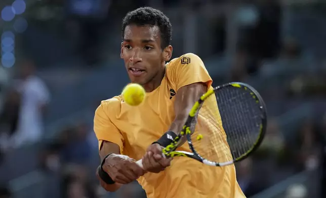 Felix Auger-Aliassime, of Canada, competes against to Andrey Rublev, of Russia, during the final match of the Madrid Open tennis tournament in Madrid, Spain, Sunday, May 5, 2024. (AP Photo/Manu Fernandez)