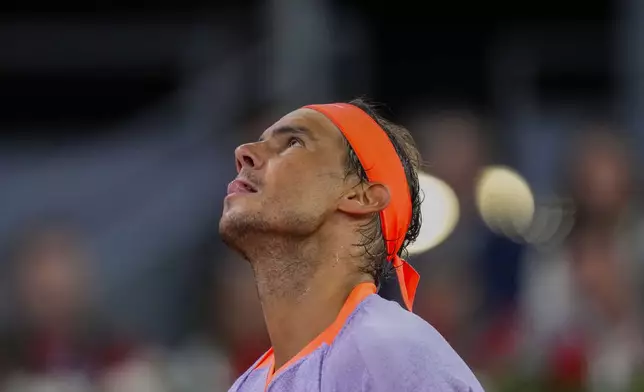Rafael Nadal, of Spain, reacts during a match against Jiri Lehecka, of Czech Republic, during the Mutua Madrid Open tennis tournament in Madrid, Tuesday, April 30, 2024. (AP Photo/Manu Fernandez)