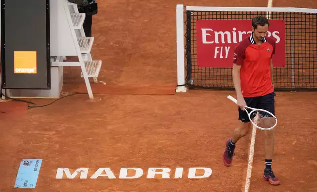 Daniil Medvedev of Russia walks past the net during the Mutua Madrid Open tennis tournament against Jiri Lehecka of the Czech Republic in Madrid, Spain, Thursday, May 2, 2024. (AP Photo/Manu Fernandez)