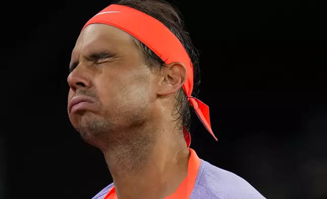 Rafael Nadal, of Spain, reacts during a match against Jiri Lehecka, of Czech Republic, during the Mutua Madrid Open tennis tournament in Madrid, Tuesday, April 30, 2024. (AP Photo/Manu Fernandez)