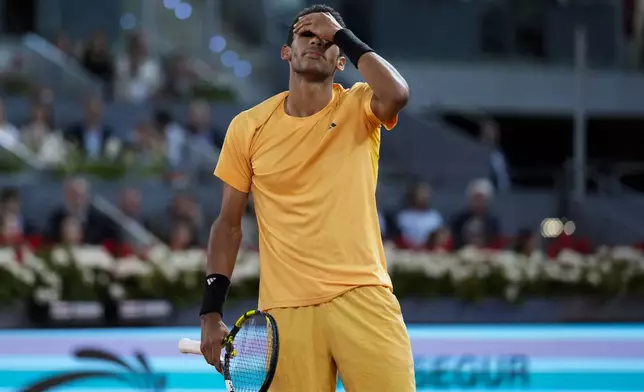 Felix Auger-Aliassime, of Canada, reacts during a final match against Andrey Rublev, of Russia, at the Madrid Open tennis tournament in Madrid, Spain, Sunday, May 5, 2024. (AP Photo/Manu Fernandez)