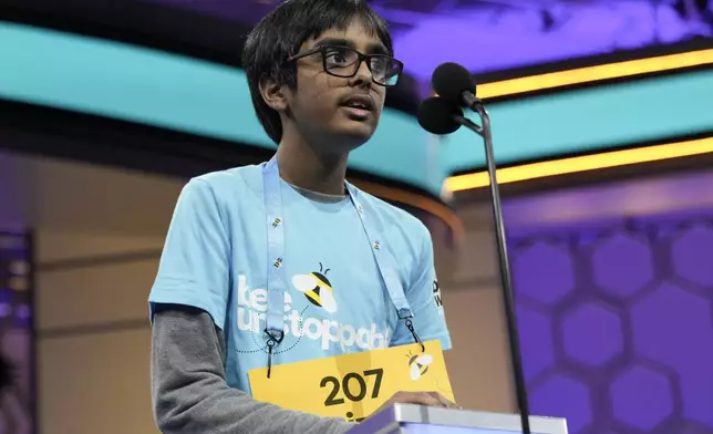 Faizan Zaki, 12, of Allen, Texas, competes in a spell-off during the finals of the Scripps National Spelling Bee, in Oxon Hill, Md., Thursday, May 30, 2024. (AP Photo/Jacquelyn Martin)