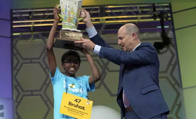 Bruhat Soma, 12, of Tampa, Fla., holds the trophy after winning the Scripps National Spelling Bee, in Oxon Hill, Md., Thursday, May 30, 2024. (AP Photo/Jacquelyn Martin)