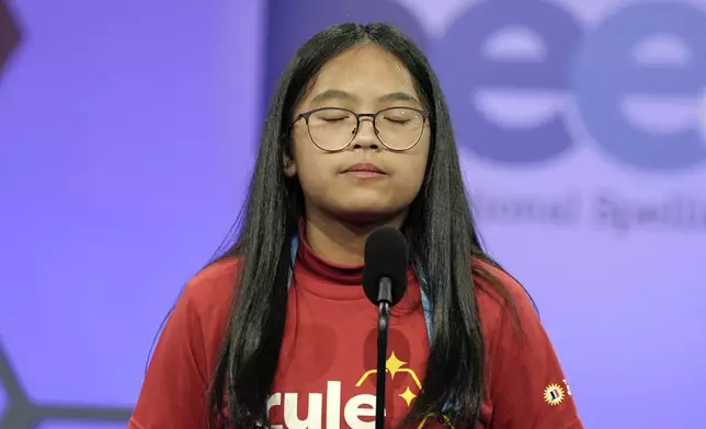 Kirsten Santos 9, of Richmond, Texas, reacts after spelling her word incorrectly in the finals of the Scripps National Spelling Bee, in Oxon Hill, Md., Thursday, May 30, 2024. (AP Photo/Mariam Zuhaib)