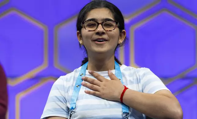 Ananya Rao Prassanna, 13, of Apex N.C., reacts after spelling her last word correctly, allowing her to continue on to the finals, at the conclusion of the semifinals of the Scripps National Spelling Bee, in Oxon Hill, Md., Wednesday, May 29, 2024. (AP Photo/Jacquelyn Martin)