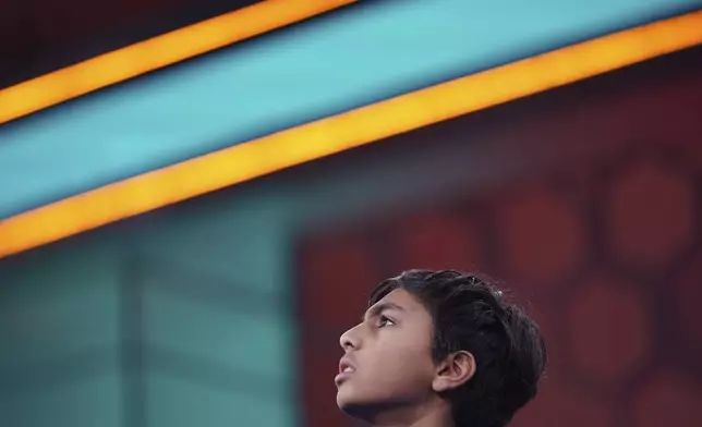 Shrey Parikh, 12, of Rancho Cucamonga, Calif., competes during the finals of the Scripps National Spelling Bee, in Oxon Hill, Md., Thursday, May 30, 2024. (AP Photo/Nathan Howard)