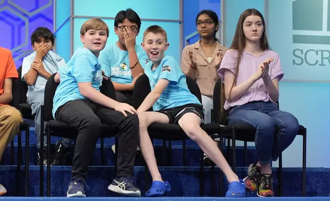 Eliminate spellers react after watching Bruhat Soma, 12, of Tampa, Fla., compete in a spell-off in the finals of the Scripps National Spelling Bee, in Oxon Hill, Md., Thursday, May 30, 2024. (AP Photo/Jacquelyn Martin)