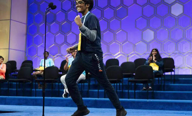 Faizan Zaki, 12, of Allen, Texas, reacts with jubilation after spelling his final word correctly during the semifinals of the Scripps National Spelling Bee, in Oxon Hill, Md., Wednesday, May 29, 2024. Eight spellers including Zaki will continue on to Thursday night's finals. (AP Photo/Jacquelyn Martin)