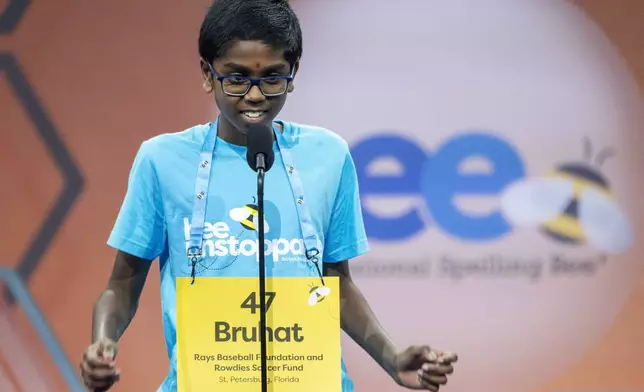 Bruhat Soma, 12, of Tampa, Fla., successfully spells his final word during the semifinals of the Scripps National Spelling Bee, in Oxon Hill, Md., Wednesday, May 29, 2024. Eight spellers including Soma will continue on to Thursday night's finals. (AP Photo/Jacquelyn Martin)