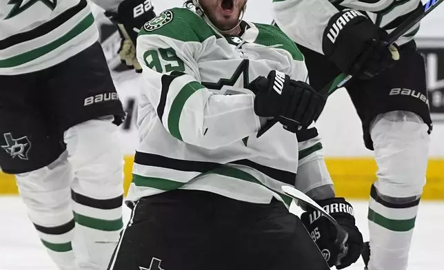 Dallas Stars center Matt Duchene celebrates after scoring the winning goal in the second overtime of Game 6 of an NHL hockey playoff series against the Colorado Avalanche Friday, May 17, 2024, in Denver. (AP Photo/David Zalubowski)